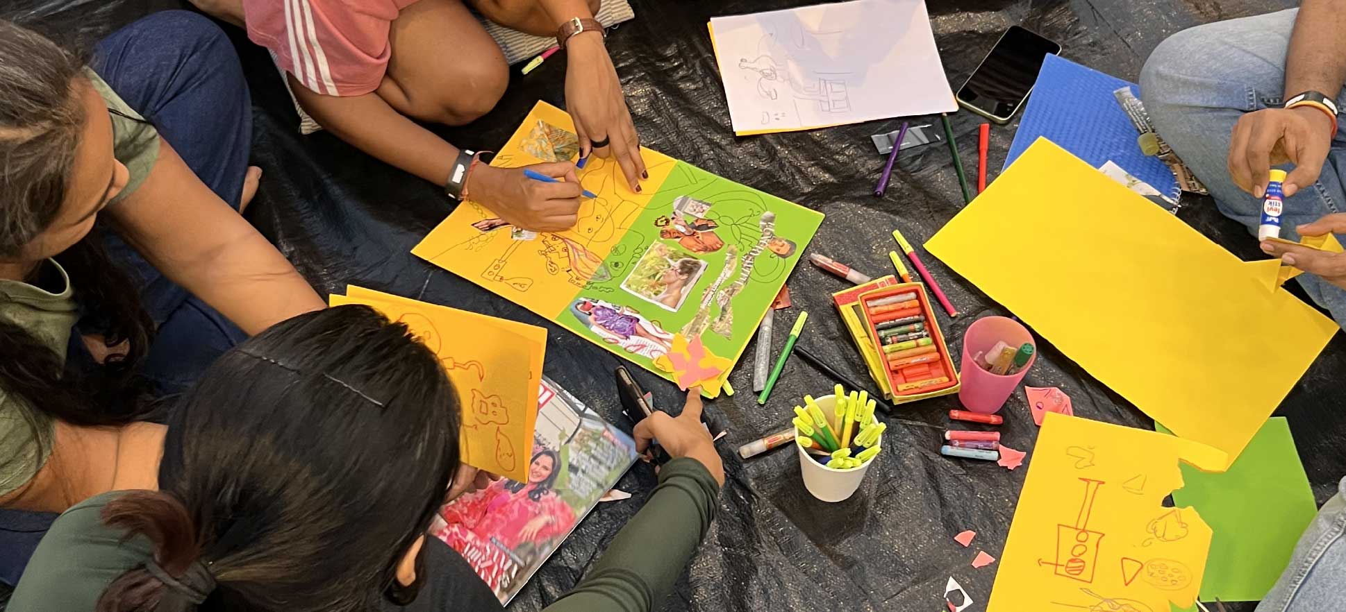 Participants creating collaborative drawings during Bad Drawing Party.